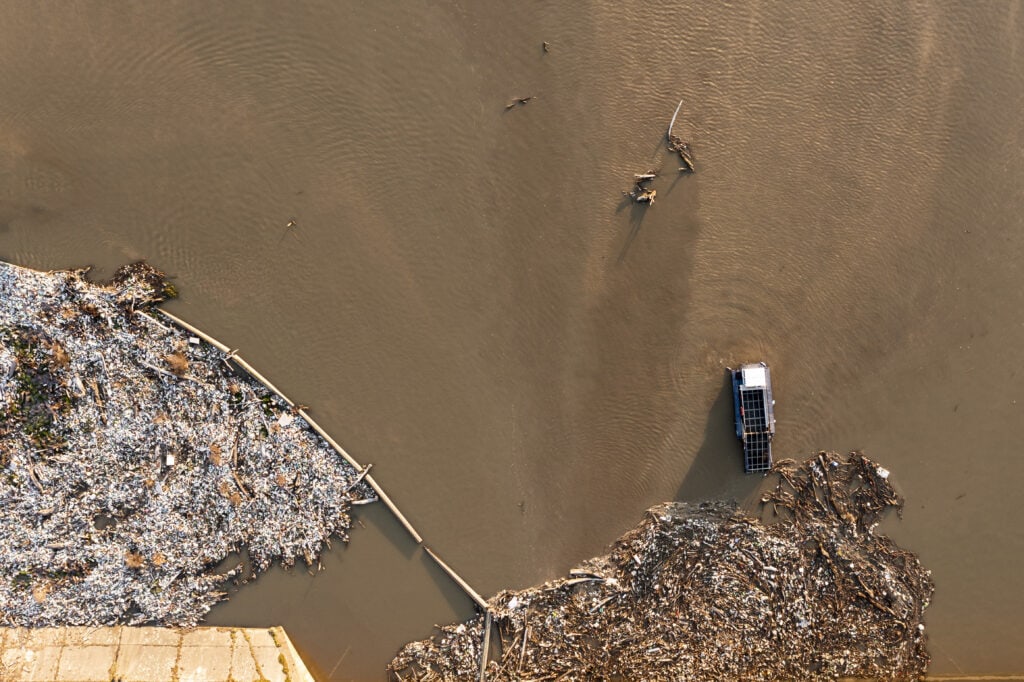Top view of lake that is cleaned up by garbage collection boat